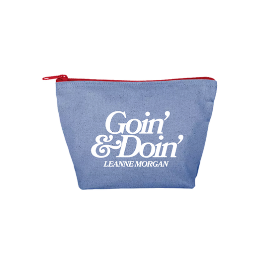 A blue canvas zippered pouch with a red zipper and a white printed logo reading 'Goin' & Doin' Leanne Morgan' on the front