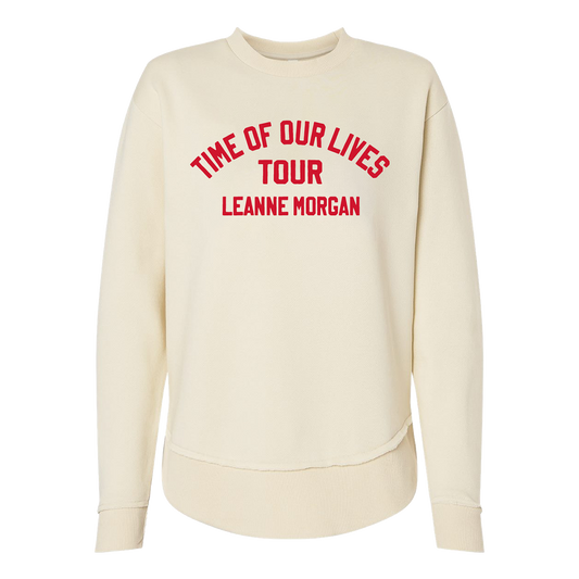 An off-white crewneck sweatshirt featuring red text on the chest that reads 'TIME OF OUR LIVES TOUR LEANNE MORGAN'