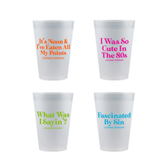 Four white frosted cups with Leanne Morgan sayings in neon