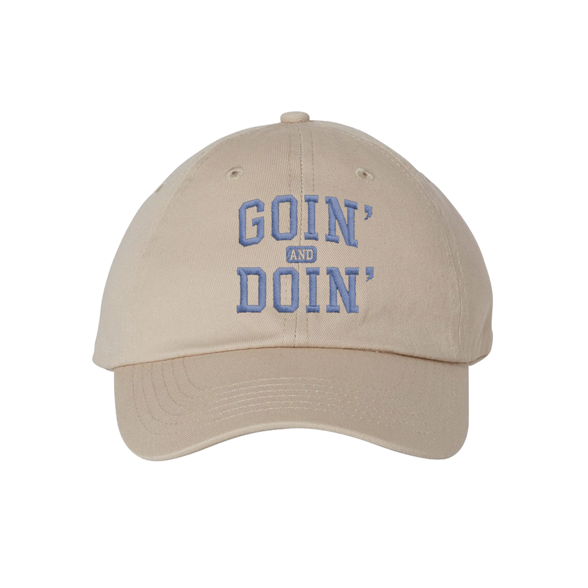 A beige baseball cap with 'GOIN' AND DOIN'' embroidered in blue on the front