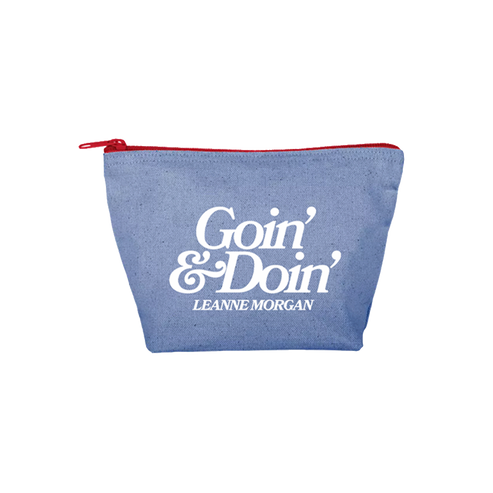 A blue canvas zippered pouch with a red zipper and a white printed logo reading 'Goin' & Doin' Leanne Morgan' on the front
